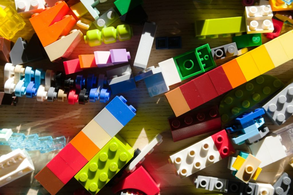 a-pile-of-colorful-building-blocks-scattered-on-a-surface-dmdtcndglw8